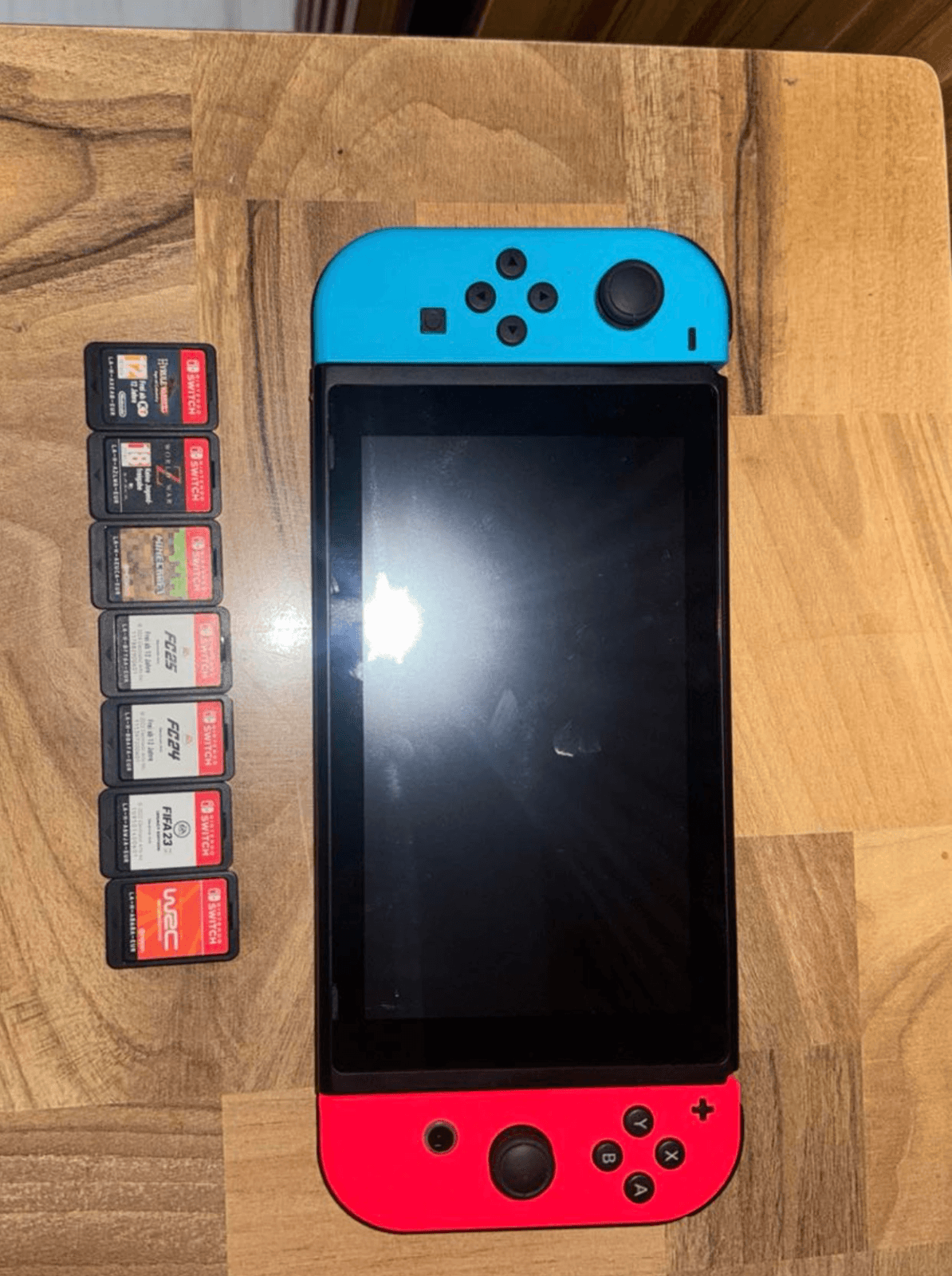 Nitendo switch me 7 lojra — foto 1 nga 1
